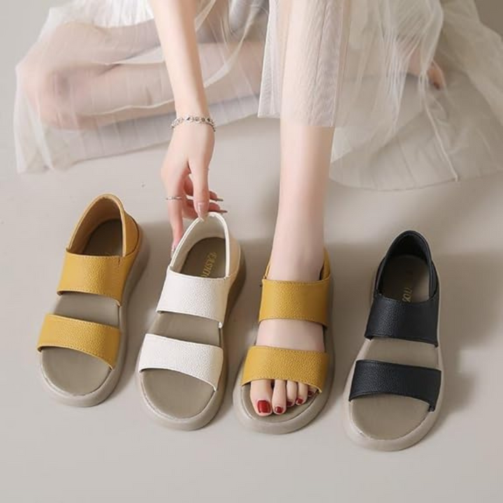 Damen-Sandalen in Gelb, Weiß und Schwarz, flach, mit breiten Riemen. Sommermode, bequemes Schuhwerk, trendige Farben.