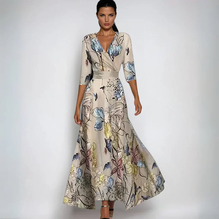 Elegantes Damenkleid mit floralem Muster, V-Ausschnitt und Dreiviertelärmeln. Perfekt für besondere Anlässe und modische Auftritte.