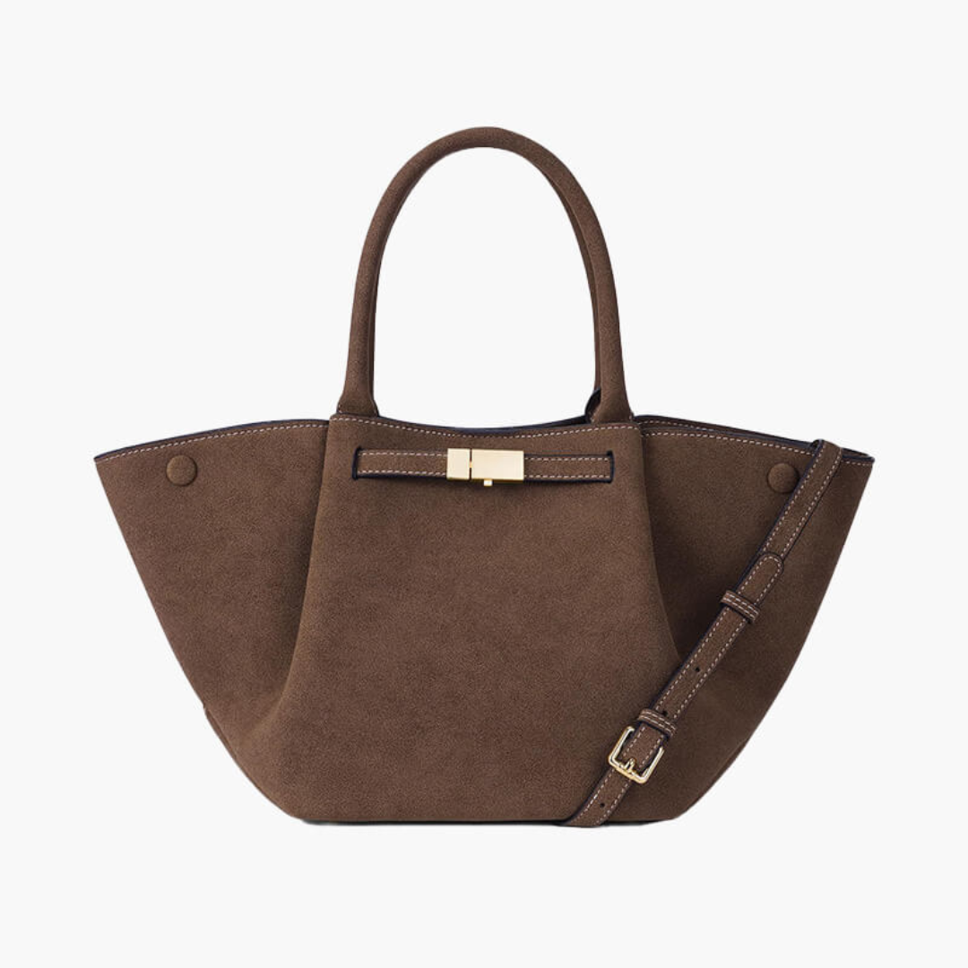 Braune Wildleder-Handtasche mit goldener Schnalle und verstellbarem Schulterriemen. Elegantes Design, ideal für Damenmode und Accessoires.