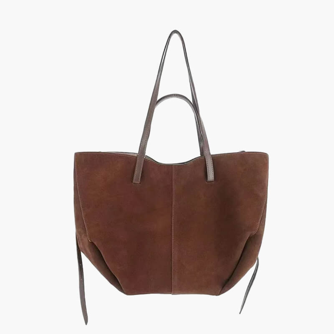 Braune Wildleder-Handtasche mit langen, schmalen Trägern, minimalistisches Design, geräumig, ideal für Alltag und Shopping.