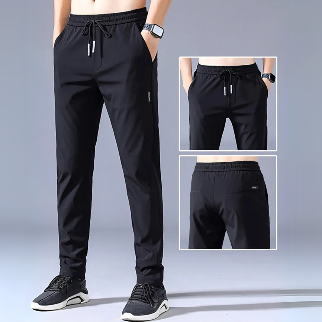 Schwarze Herren-Sporthose, elastischer Bund, Taschen, atmungsaktives Material, ideal für Fitness und Freizeit, moderne Passform, sportlich elegant.