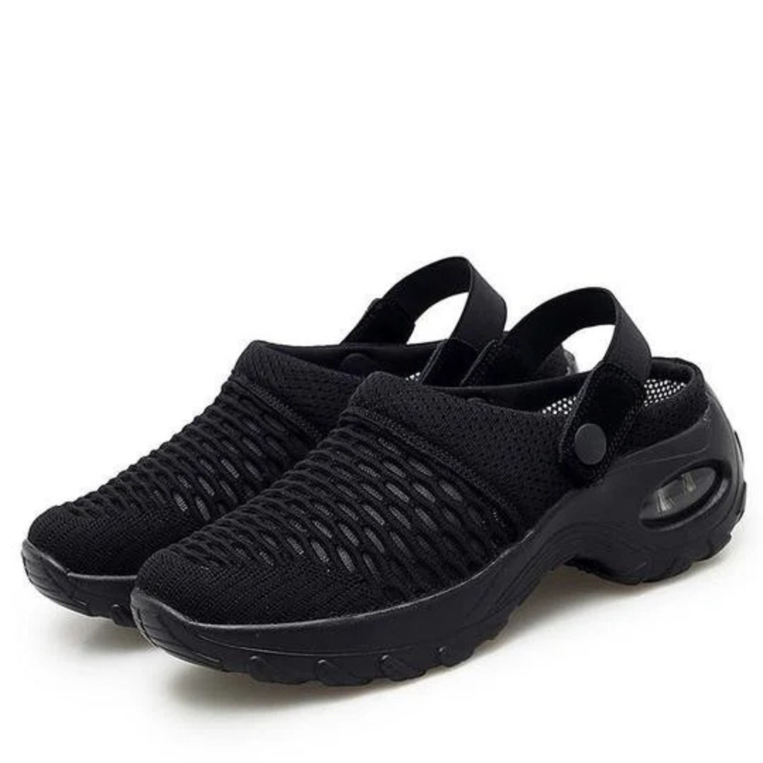 Schwarze atmungsaktive Clogs mit Netzdesign und rutschfester Sohle, ideal für Sommer und Outdoor-Aktivitäten. Bequeme Freizeitschuhe für Damen und Herren.