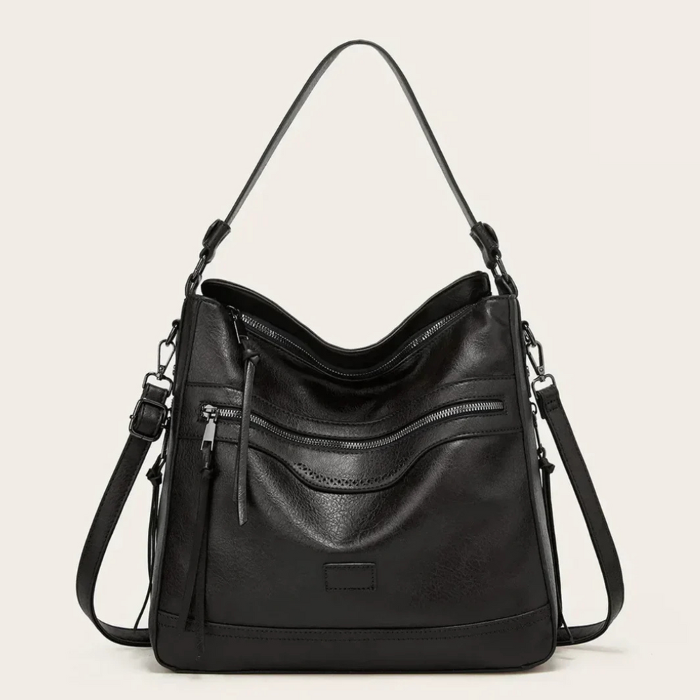 Schwarze Lederhandtasche mit verstellbarem Schulterriemen, mehreren Reißverschlusstaschen und elegantem Design. Perfekt für Damenmode und Alltag.