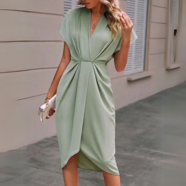 Grünes Wickelkleid Damenmode, elegantes Design, knielang, V-Ausschnitt, Sommerkleid, stilvoll, modern, ideal für Freizeit und Büro.