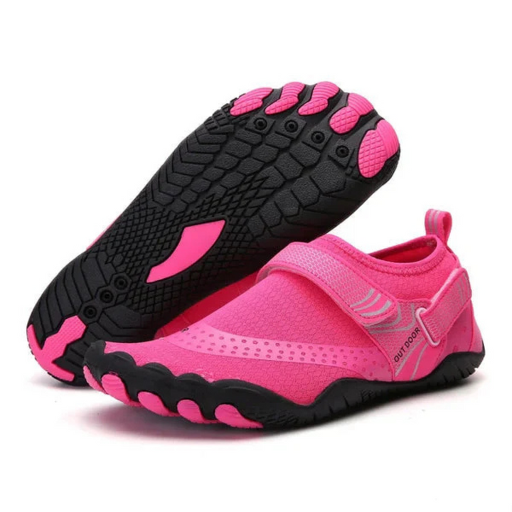 Pinkfarbene Barfußschuhe mit rutschfester Sohle, ideal für Outdoor-Aktivitäten. Leichtes, atmungsaktives Design für maximalen Komfort.