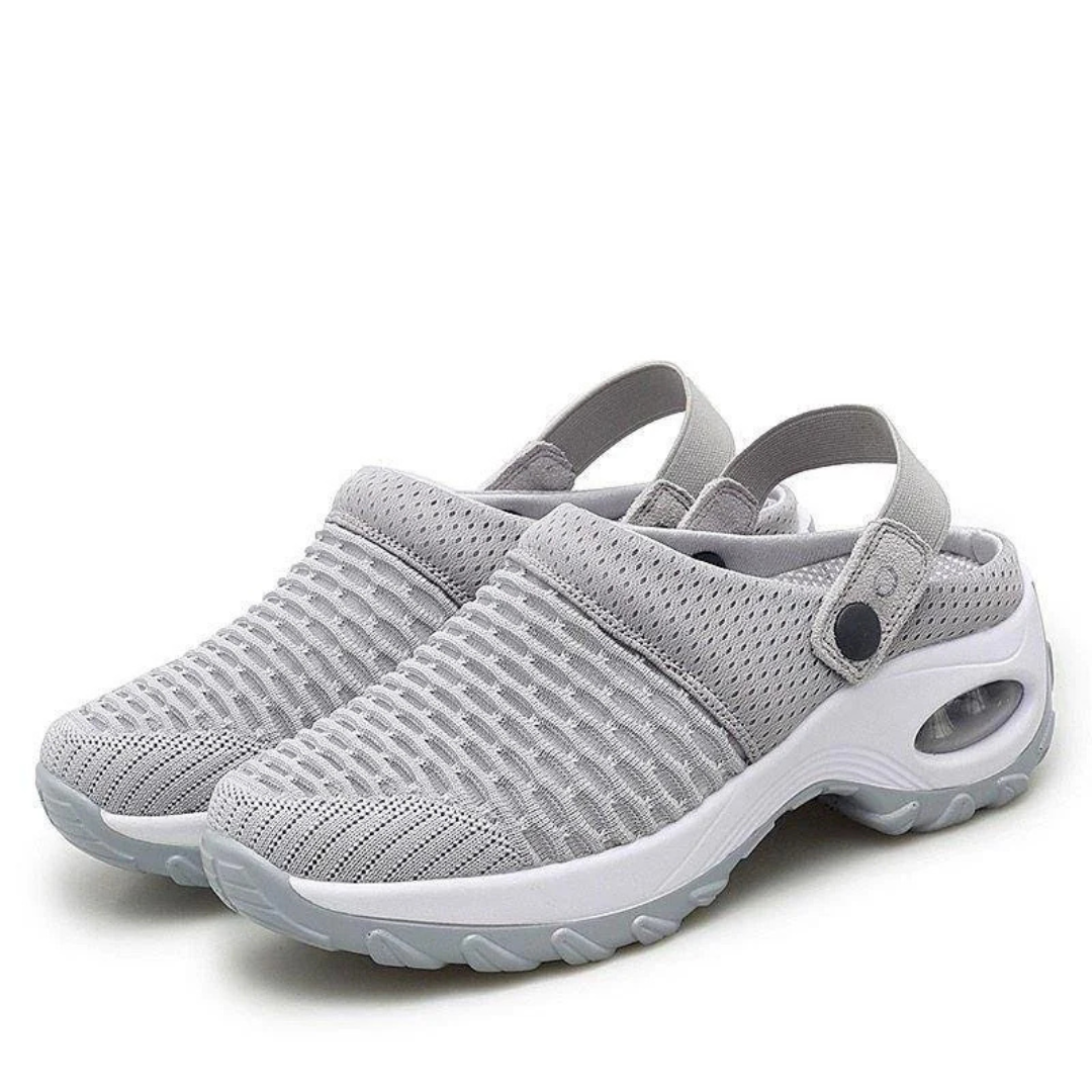 Graue atmungsaktive Clogs für Damen, mit rutschfester Sohle und verstellbarem Fersenriemen, ideal für Sommer und Freizeit.