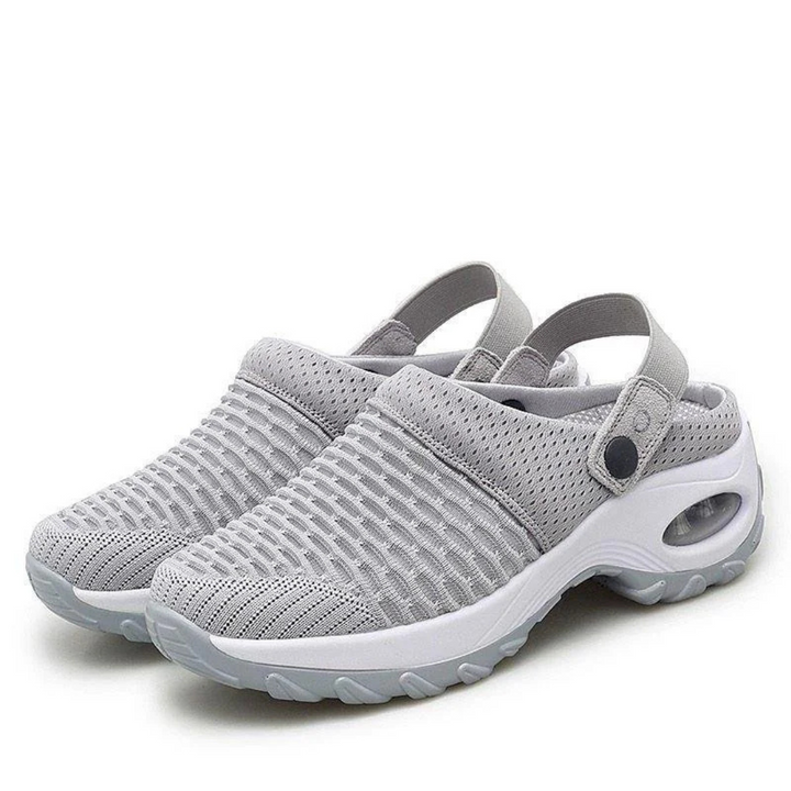 Graue atmungsaktive Clogs für Damen, mit rutschfester Sohle und verstellbarem Fersenriemen, ideal für Sommer und Freizeit.