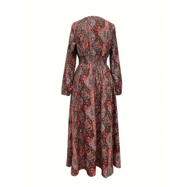 Langes Damenkleid mit Paisley-Muster, rot und grün, langärmlig, tailliert, aus Baumwolle. Perfekt für Herbstmode und elegante Anlässe.