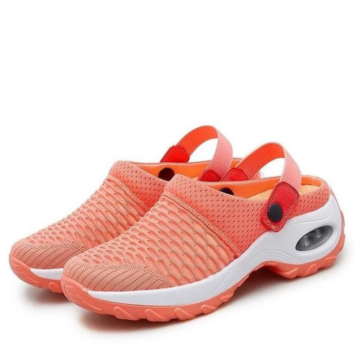 Orange Damen-Clogs mit atmungsaktivem Mesh-Obermaterial, rutschfester Sohle und verstellbarem Fersenriemen. Ideal für Sommer und Freizeit.