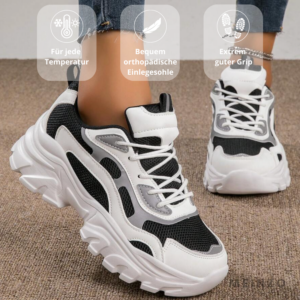 Schwarze und weiße Sneaker mit dicker Sohle, orthopädischer Einlegesohle und gutem Grip, ideal für jede Temperatur. Perfekt für Komfort und Stil.